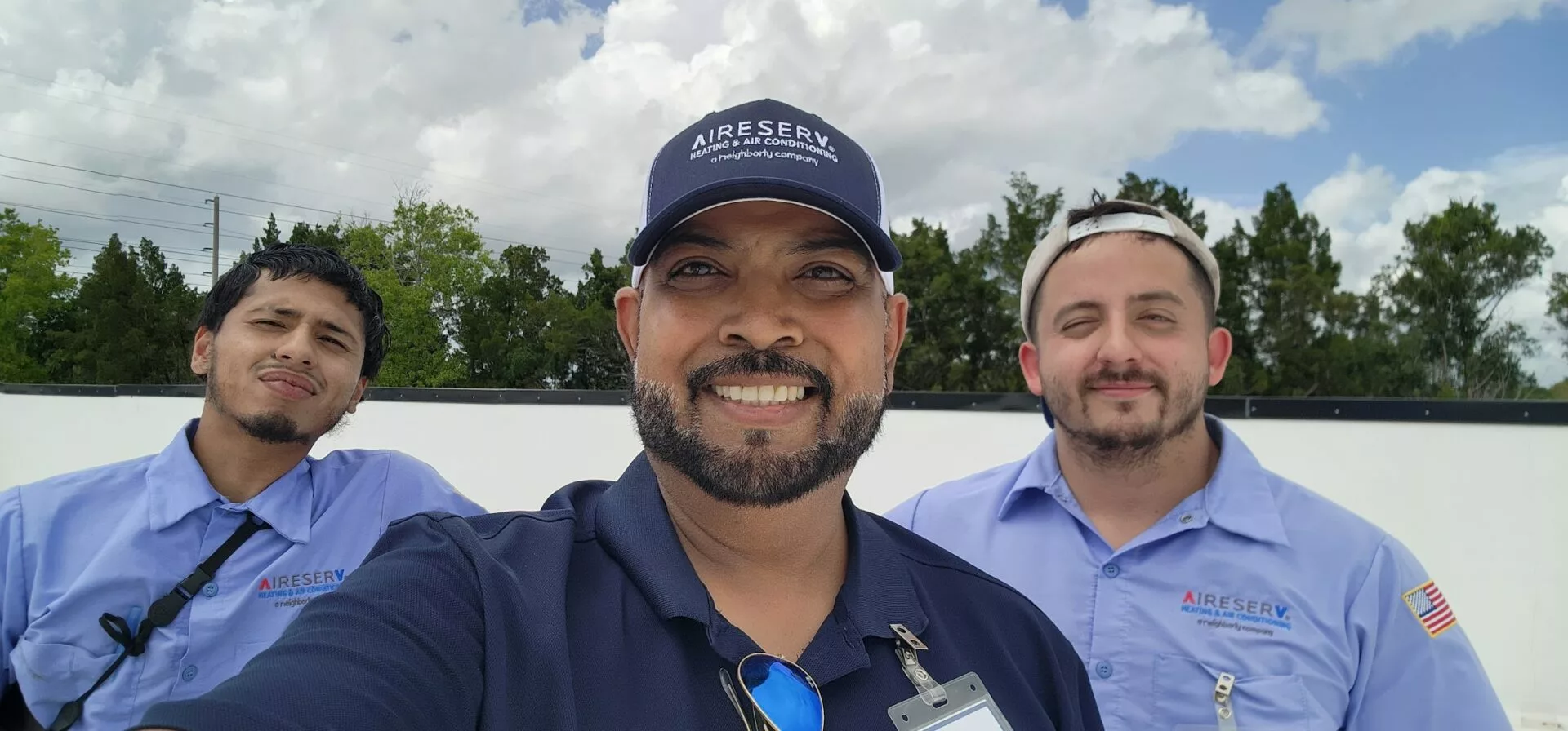 Aire Serv HVAC technician professionally inspecting a system