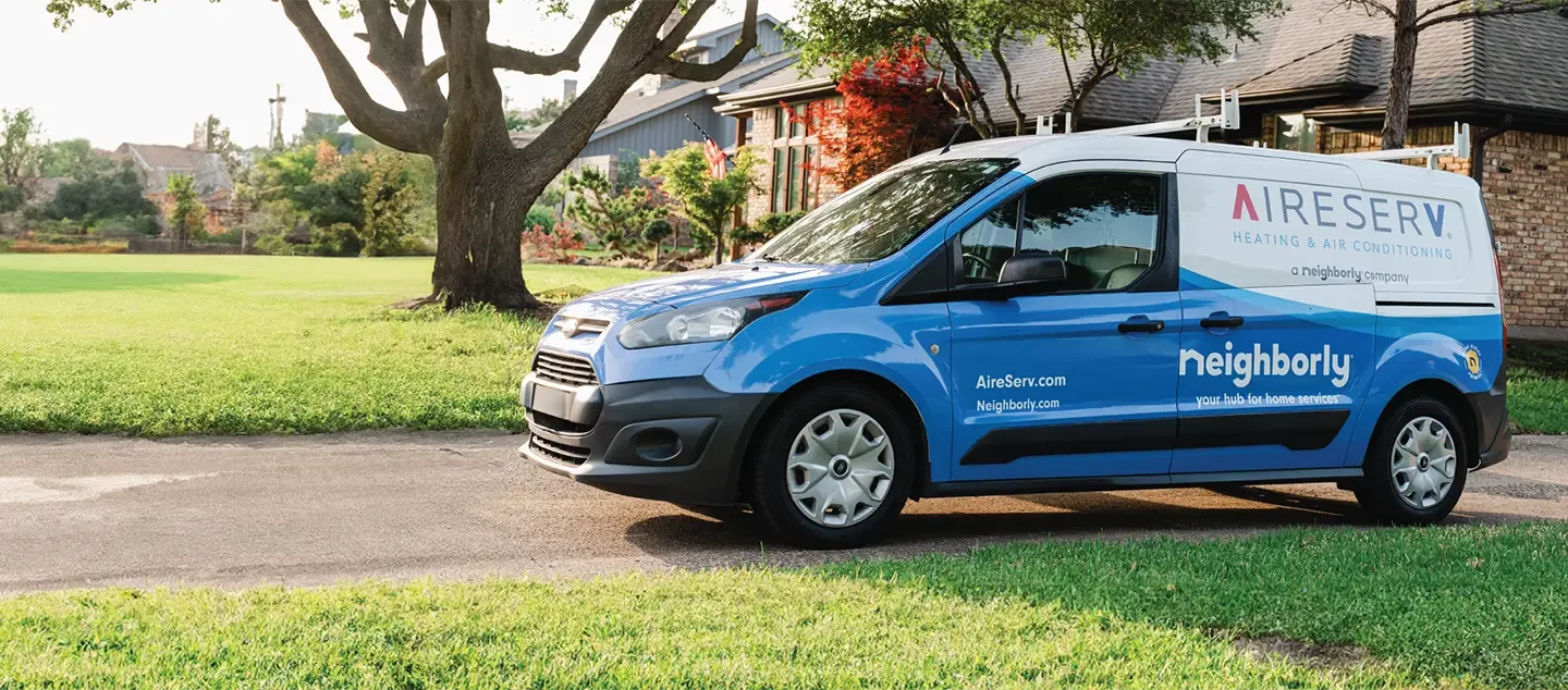 Aire Serv HVAC technician with service van